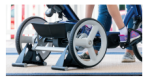 Stationary stand behind wheels to lock in place